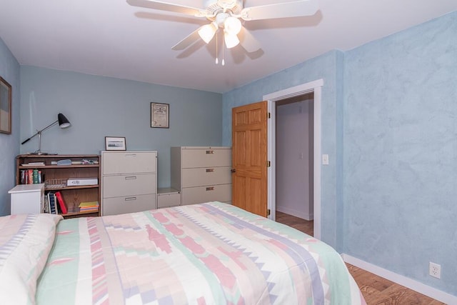 bedroom featuring ceiling fan and light hardwood / wood-style floors