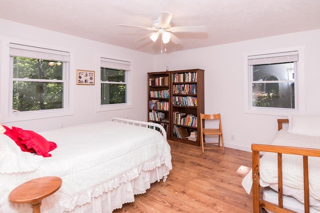 bedroom featuring ceiling fan and light hardwood / wood-style floors