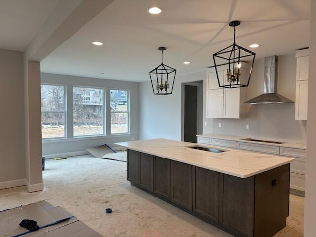 kitchen featuring wall chimney exhaust hood, white cabinetry, black electric cooktop, and recessed lighting