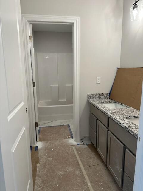 bathroom with shower / bath combination and vanity