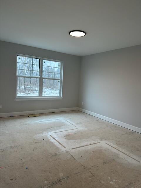 empty room with baseboards