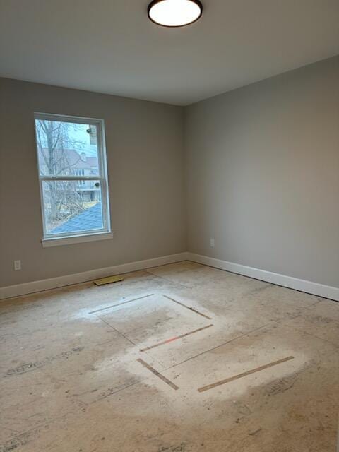 empty room with baseboards