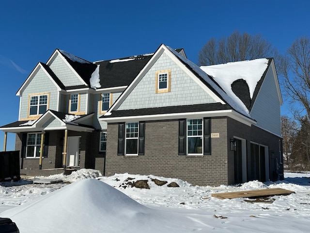 view of front of house with brick siding