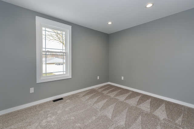 empty room featuring carpet flooring