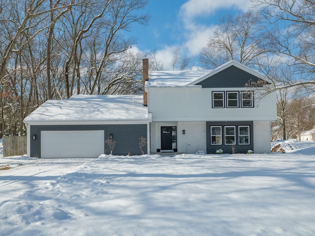 view of front of property with a garage