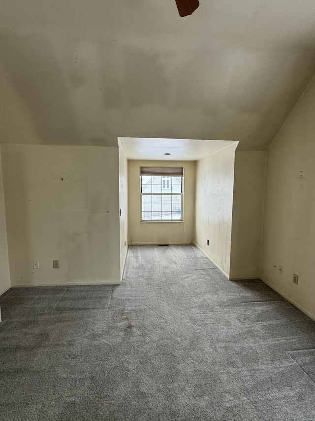 bonus room with ceiling fan, lofted ceiling, and carpet