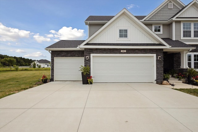 view of front of home featuring a garage and a front lawn