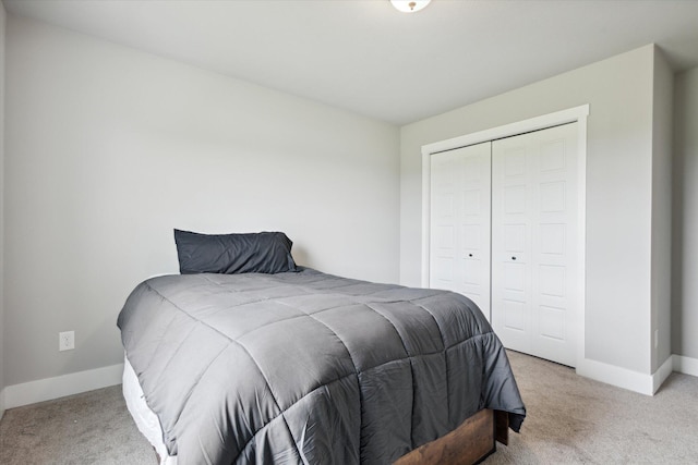 carpeted bedroom featuring a closet