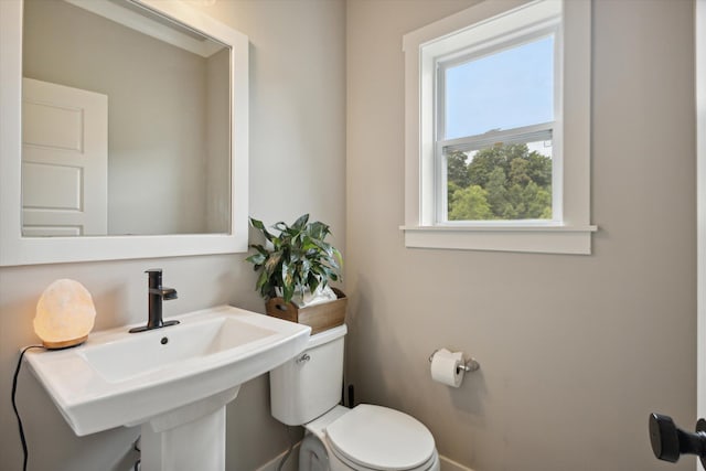 bathroom with toilet and sink