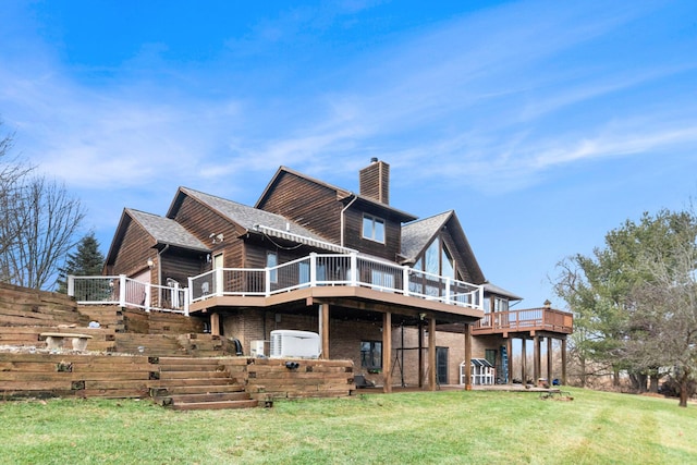 back of house featuring a yard and a deck