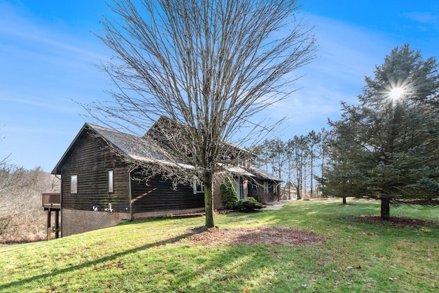 view of side of property featuring a yard