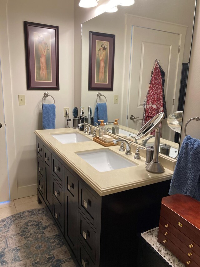 bathroom featuring tile patterned flooring and vanity