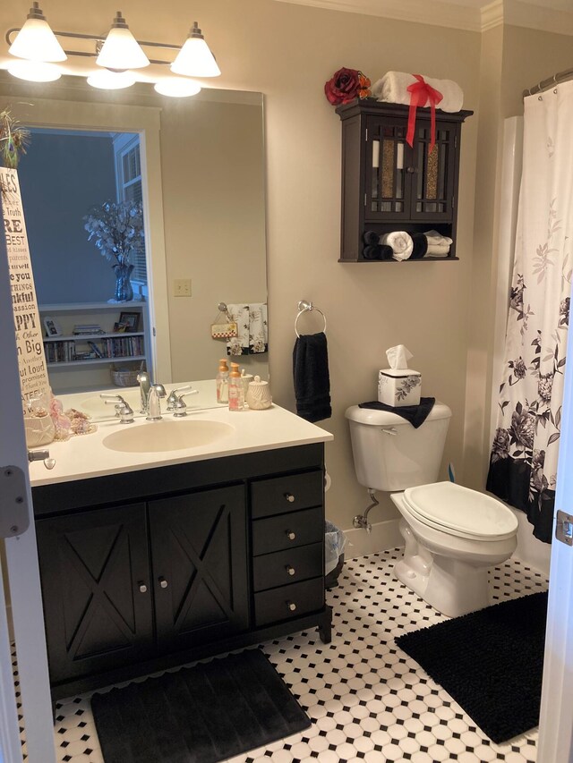 bathroom with tile patterned floors, vanity, and toilet