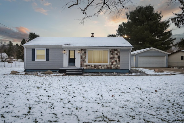 view of front of home featuring an outbuilding and a garage