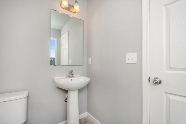 bathroom with toilet and sink