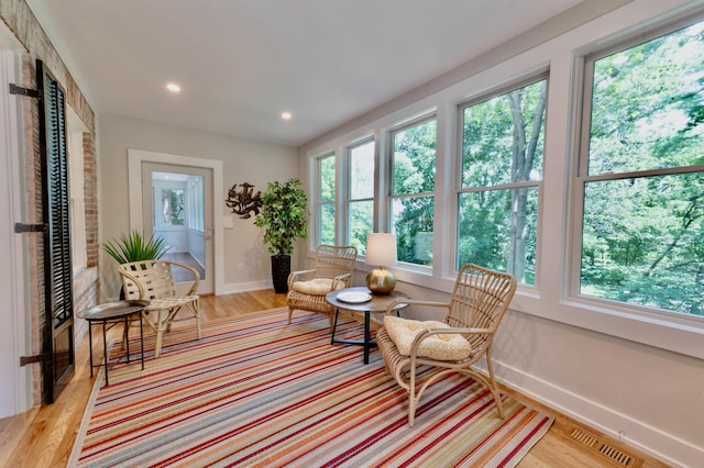 sitting room featuring light hardwood / wood-style floors and a wealth of natural light