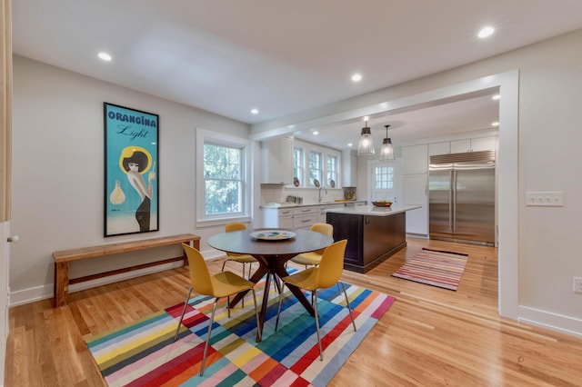 dining space with light hardwood / wood-style floors