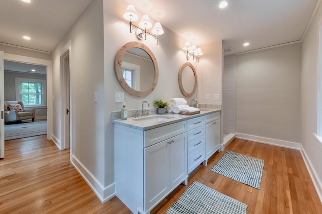 bathroom with vanity and wood-type flooring