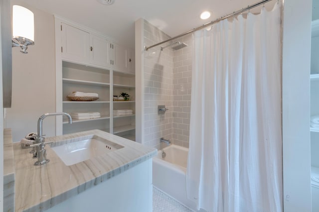 bathroom featuring sink and shower / tub combo with curtain