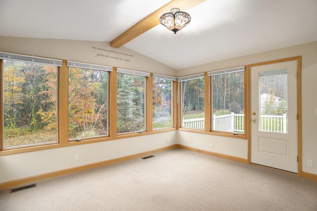 unfurnished sunroom with vaulted ceiling with beams