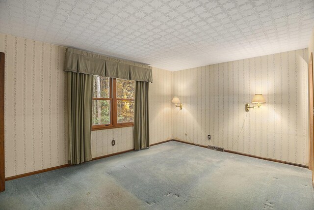 unfurnished room featuring carpet flooring