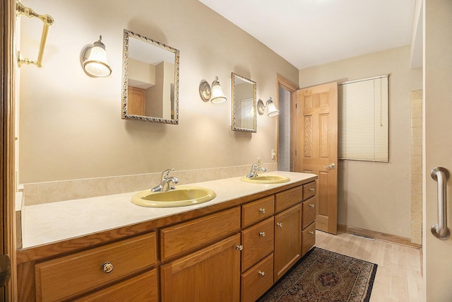 bathroom featuring vanity and wood-type flooring