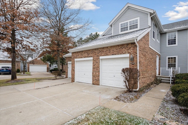 view of side of home featuring a garage