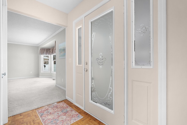 hall with crown molding, parquet floors, and a textured ceiling