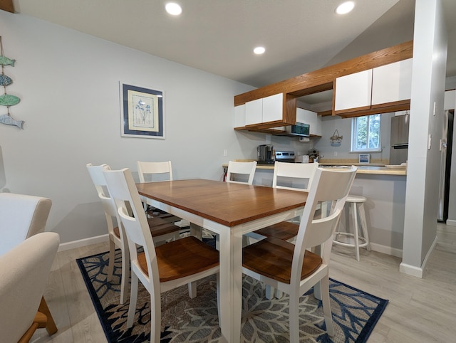 dining room with light hardwood / wood-style flooring