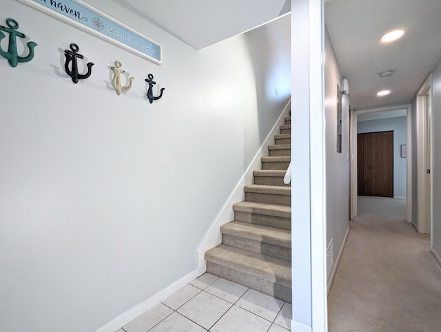 stairway featuring tile patterned floors