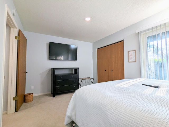 carpeted bedroom featuring a closet