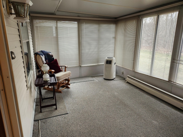 unfurnished sunroom featuring a baseboard radiator