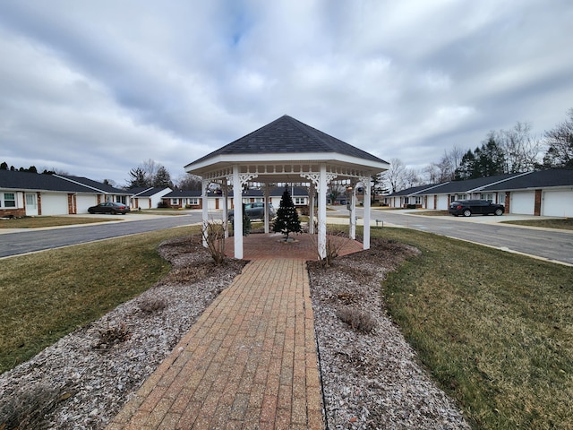 view of property's community featuring a gazebo and a lawn