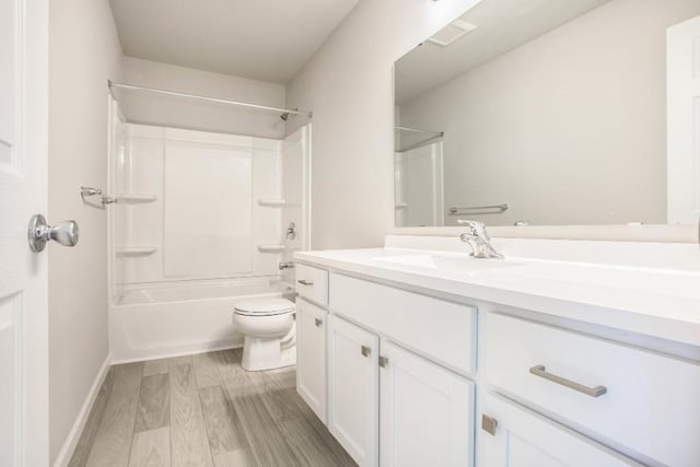 full bathroom with toilet, vanity,  shower combination, and hardwood / wood-style flooring