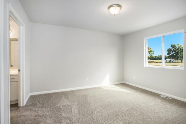 unfurnished room with carpet floors