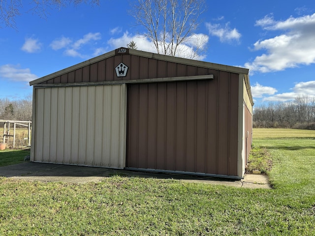 view of outdoor structure featuring a lawn