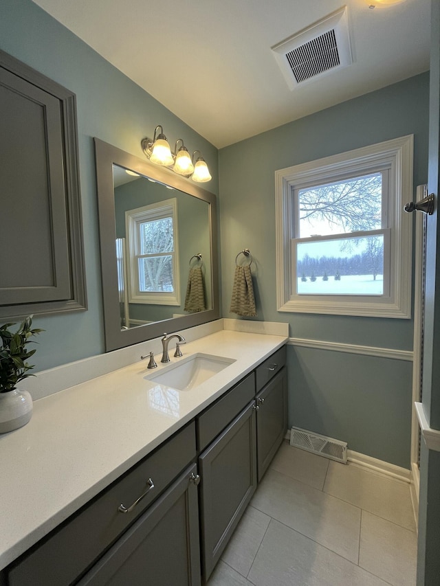 bathroom with tile patterned flooring and vanity