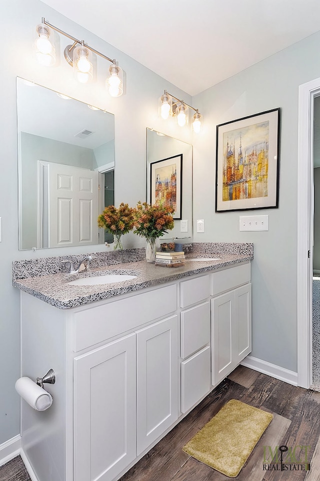 bathroom with hardwood / wood-style flooring and vanity