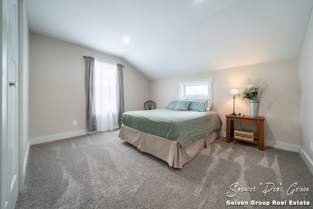 bedroom featuring carpet flooring and vaulted ceiling