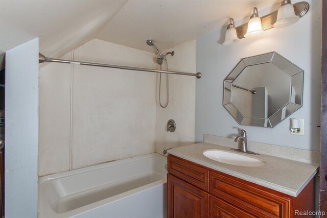 bathroom featuring vanity and shower / bath combination