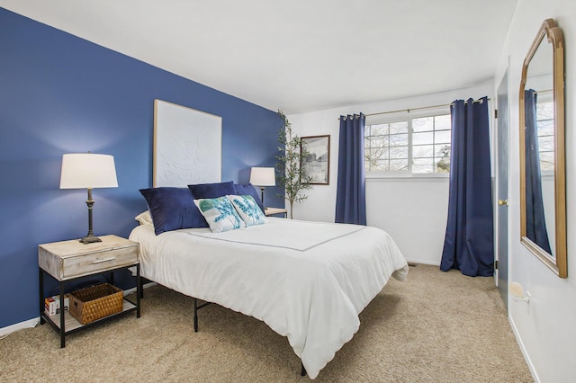 bedroom featuring light colored carpet