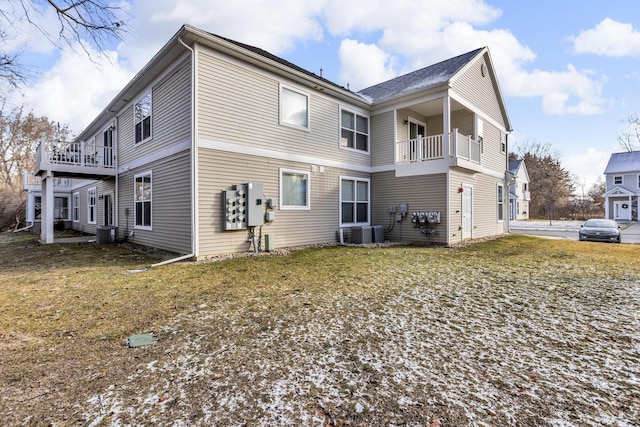 back of house with a balcony and central AC