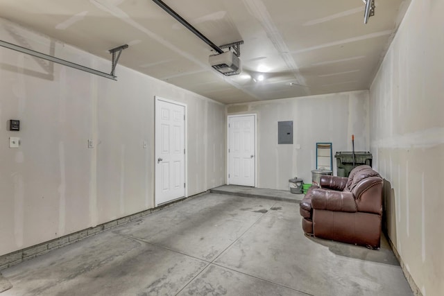 garage with electric panel and a garage door opener