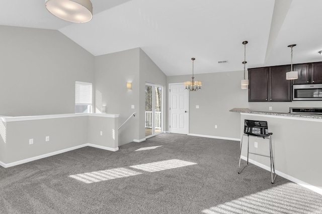 kitchen with dark carpet, decorative light fixtures, vaulted ceiling, a notable chandelier, and dark brown cabinetry