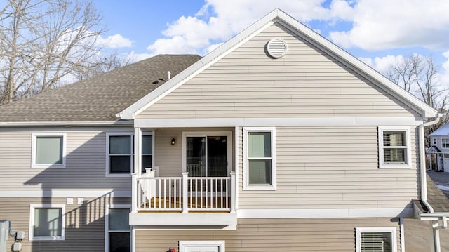 rear view of house featuring a balcony