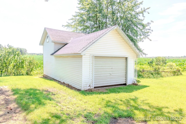 garage with a yard