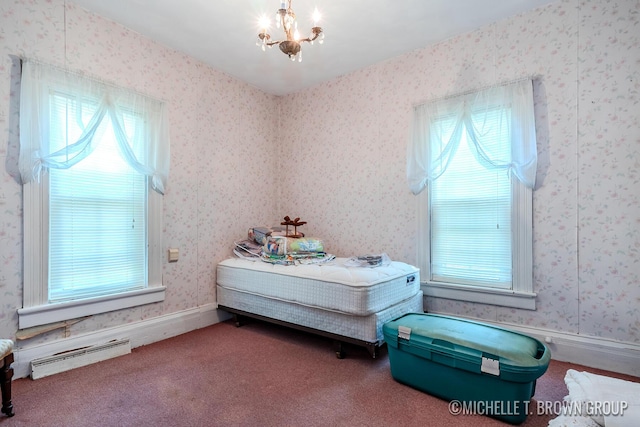 bedroom featuring carpet and a notable chandelier