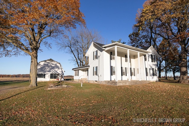 view of side of home featuring a yard