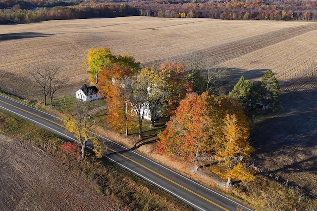 birds eye view of property with a rural view