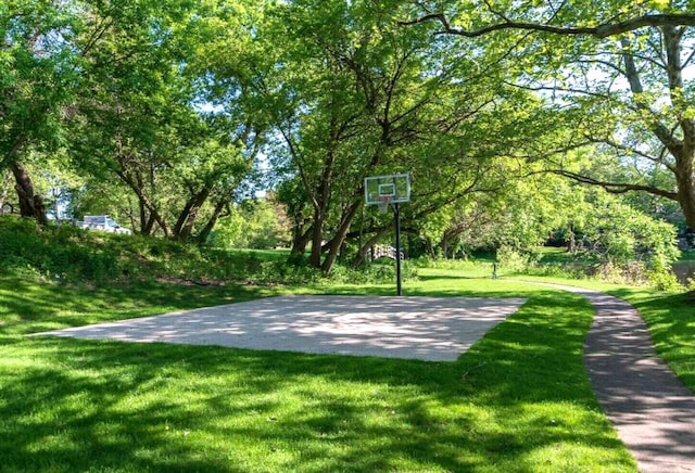 view of basketball court featuring a lawn